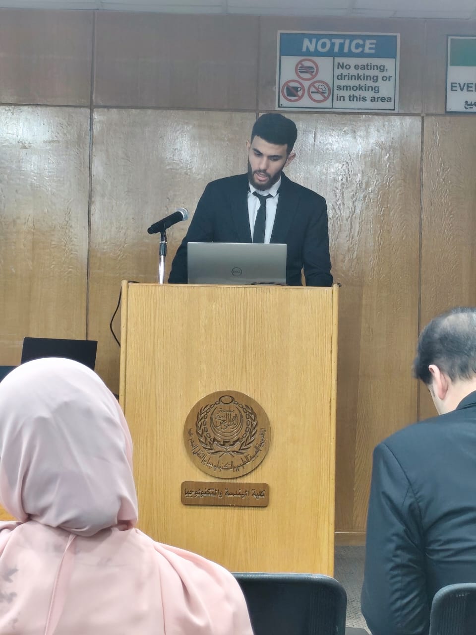 Basel Ziada presenting research at a podium